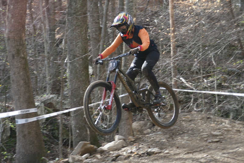 Tennessee National Mountain Bike Festival 2023 LI.jpg :: Tennessee National 2023 - Tennessee Mountain Bike Festival 2023 - Windrock Bicycle Park in Oliver Springs, Tennessee, USA. Mountain Bike Downhill on the wooded trail in hills of Tennessee. Fast downhill action with aerials throughout the run. Red Bull gives you wings. 