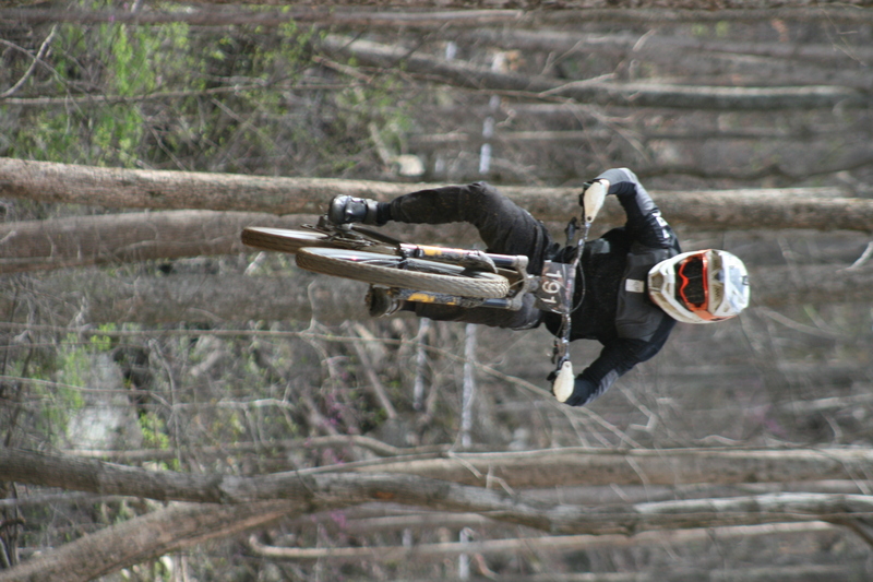 Tennessee National Mountain Bike Festival 2023 LV.jpg :: Tennessee National 2023 - Tennessee Mountain Bike Festival 2023 - Windrock Bicycle Park in Oliver Springs, Tennessee, USA. Mountain Bike Downhill on the wooded trail in hills of Tennessee. Fast downhill action with aerials throughout the run. Red Bull gives you wings. 