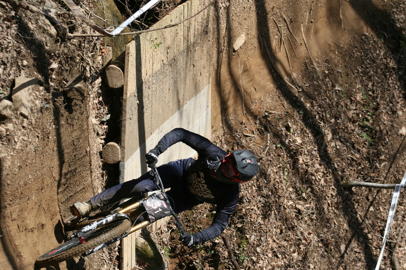Tennessee National Mountain Bike Festival 2023 LXVI.jpg :: Tennessee National 2023 - Tennessee Mountain Bike Festival 2023 - Windrock Bicycle Park in Oliver Springs, Tennessee, USA. Mountain Bike Downhill on the wooded trail in hills of Tennessee. Fast downhill action with aerials throughout the run. Red Bull gives you wings. 