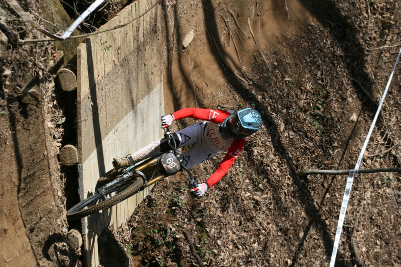 Tennessee National Mountain Bike Festival 2023 LXVII.jpg :: Tennessee National 2023 - Tennessee Mountain Bike Festival 2023 - Windrock Bicycle Park in Oliver Springs, Tennessee, USA. Mountain Bike Downhill on the wooded trail in hills of Tennessee. Fast downhill action with aerials throughout the run. Red Bull gives you wings. 