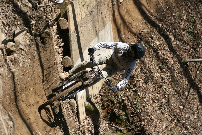 Tennessee National Mountain Bike Festival 2023 LXVIII.jpg :: Tennessee National 2023 - Tennessee Mountain Bike Festival 2023 - Windrock Bicycle Park in Oliver Springs, Tennessee, USA. Mountain Bike Downhill on the wooded trail in hills of Tennessee. Fast downhill action with aerials throughout the run. Red Bull gives you wings. 