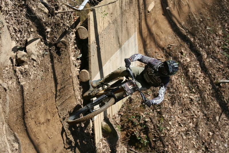 Tennessee National Mountain Bike Festival 2023 LXX.jpg :: Tennessee National 2023 - Tennessee Mountain Bike Festival 2023 - Windrock Bicycle Park in Oliver Springs, Tennessee, USA. Mountain Bike Downhill on the wooded trail in hills of Tennessee. Fast downhill action with aerials throughout the run. Red Bull gives you wings. 
