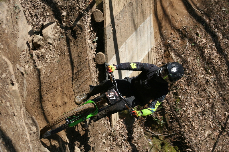 Tennessee National Mountain Bike Festival 2023 LXXII.jpg :: Tennessee National 2023 - Tennessee Mountain Bike Festival 2023 - Windrock Bicycle Park in Oliver Springs, Tennessee, USA. Mountain Bike Downhill on the wooded trail in hills of Tennessee. Fast downhill action with aerials throughout the run. Red Bull gives you wings. 