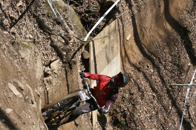 Tennessee National Mountain Bike Festival 2023 LXXIII.jpg :: Tennessee National 2023 - Tennessee Mountain Bike Festival 2023 - Windrock Bicycle Park in Oliver Springs, Tennessee, USA. Mountain Bike Downhill on the wooded trail in hills of Tennessee. Fast downhill action with aerials throughout the run. Red Bull gives you wings. 