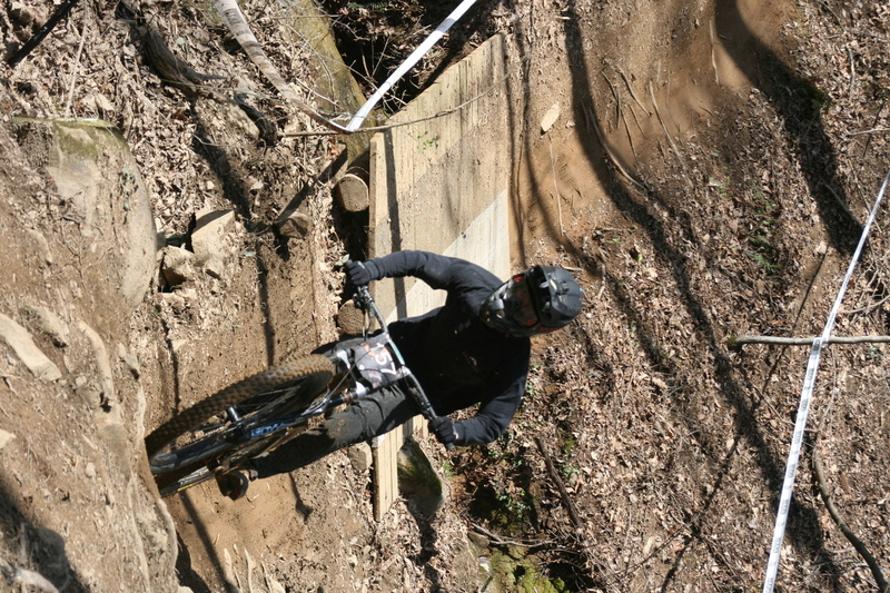 Tennessee National Mountain Bike Festival 2023 LXXV.jpg :: Tennessee National 2023 - Tennessee Mountain Bike Festival 2023 - Windrock Bicycle Park in Oliver Springs, Tennessee, USA. Mountain Bike Downhill on the wooded trail in hills of Tennessee. Fast downhill action with aerials throughout the run. Red Bull gives you wings. 