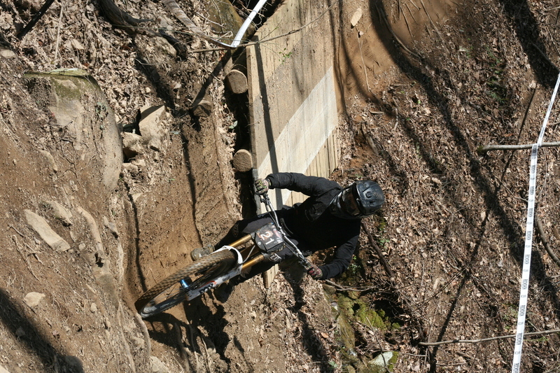 Tennessee National Mountain Bike Festival 2023 LXXVI.jpg :: Tennessee National 2023 - Tennessee Mountain Bike Festival 2023 - Windrock Bicycle Park in Oliver Springs, Tennessee, USA. Mountain Bike Downhill on the wooded trail in hills of Tennessee. Fast downhill action with aerials throughout the run. Red Bull gives you wings. 