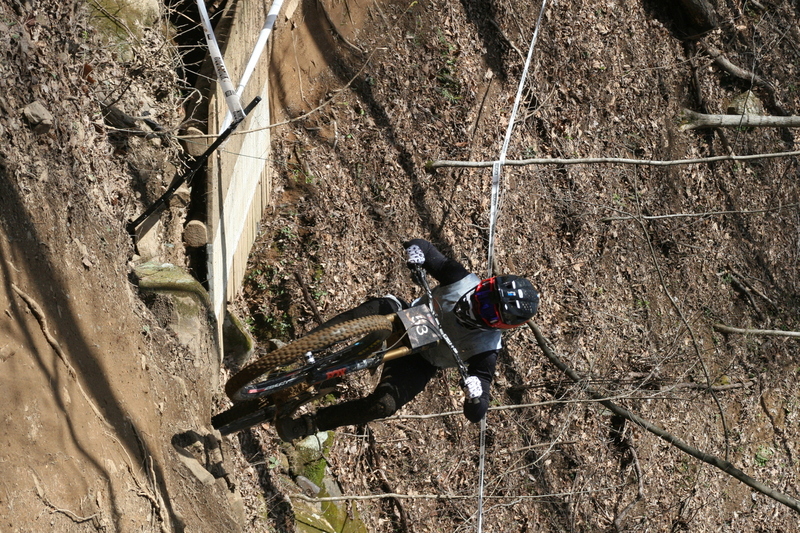 Tennessee National Mountain Bike Festival 2023 LXXXII.jpg :: Tennessee National 2023 - Tennessee Mountain Bike Festival 2023 - Windrock Bicycle Park in Oliver Springs, Tennessee, USA. Mountain Bike Downhill on the wooded trail in hills of Tennessee. Fast downhill action with aerials throughout the run. Red Bull gives you wings. 