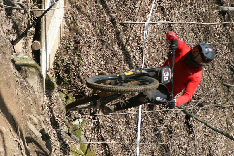 Tennessee National Mountain Bike Festival 2023 LXXXIII.jpg :: Tennessee National 2023 - Tennessee Mountain Bike Festival 2023 - Windrock Bicycle Park in Oliver Springs, Tennessee, USA. Mountain Bike Downhill on the wooded trail in hills of Tennessee. Fast downhill action with aerials throughout the run. Red Bull gives you wings. 