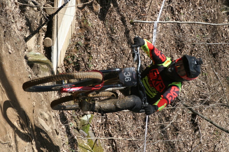 Tennessee National Mountain Bike Festival 2023 LXXXIV.jpg :: Tennessee National 2023 - Tennessee Mountain Bike Festival 2023 - Windrock Bicycle Park in Oliver Springs, Tennessee, USA. Mountain Bike Downhill on the wooded trail in hills of Tennessee. Fast downhill action with aerials throughout the run. Red Bull gives you wings. 