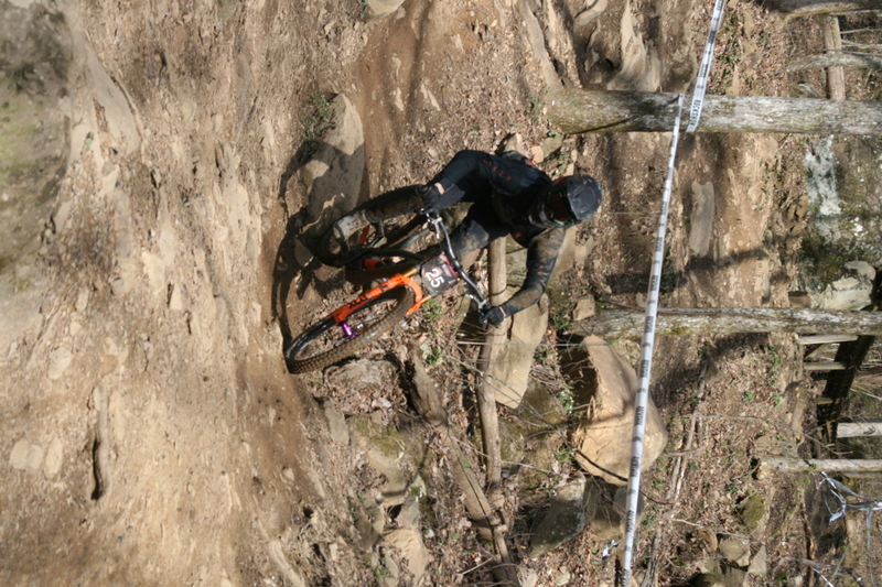Tennessee National Mountain Bike Festival 2023 LXXXXII.jpg :: Tennessee National 2023 - Tennessee Mountain Bike Festival 2023 - Windrock Bicycle Park in Oliver Springs, Tennessee, USA. Mountain Bike Downhill on the wooded trail in hills of Tennessee. Fast downhill action with aerials throughout the run. Red Bull gives you wings. 
