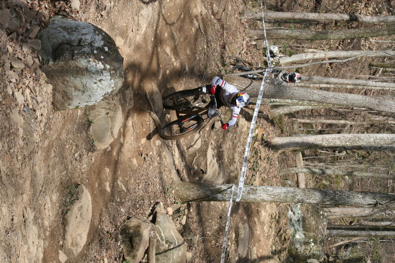 Tennessee National Mountain Bike Festival 2023 LXXXXIV.jpg :: Tennessee National 2023 - Tennessee Mountain Bike Festival 2023 - Windrock Bicycle Park in Oliver Springs, Tennessee, USA. Mountain Bike Downhill on the wooded trail in hills of Tennessee. Fast downhill action with aerials throughout the run. Red Bull gives you wings. 