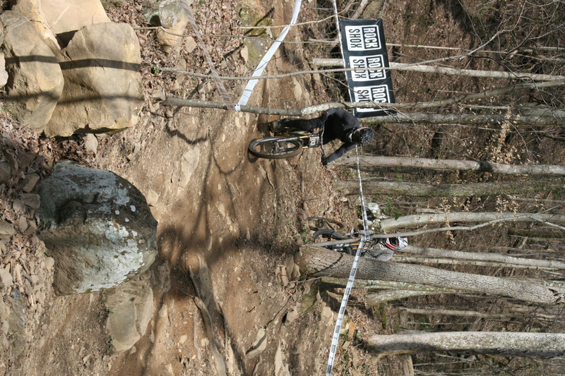 Tennessee National Mountain Bike Festival 2023 LXXXXVI.jpg :: Tennessee National 2023 - Tennessee Mountain Bike Festival 2023 - Windrock Bicycle Park in Oliver Springs, Tennessee, USA. Mountain Bike Downhill on the wooded trail in hills of Tennessee. Fast downhill action with aerials throughout the run. Red Bull gives you wings. 