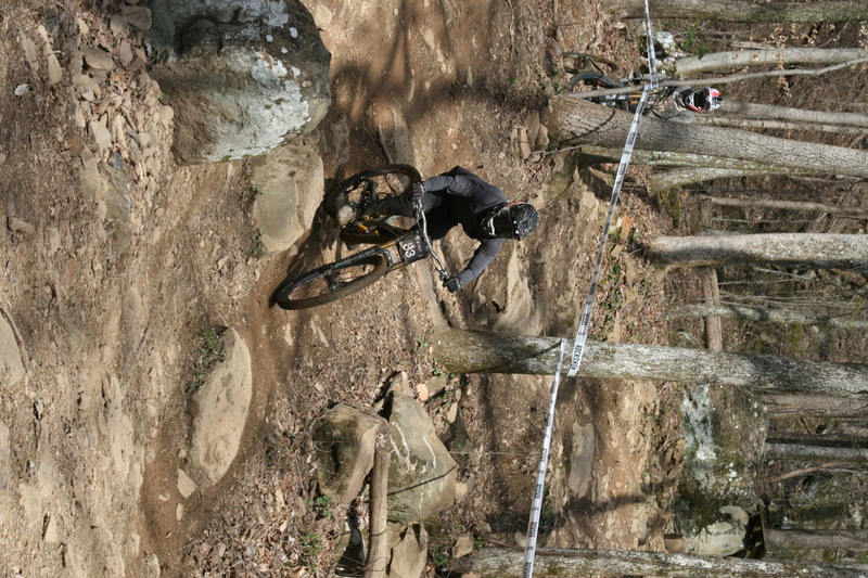 Tennessee National Mountain Bike Festival 2023 LXXXXVII.jpg :: Tennessee National 2023 - Tennessee Mountain Bike Festival 2023 - Windrock Bicycle Park in Oliver Springs, Tennessee, USA. Mountain Bike Downhill on the wooded trail in hills of Tennessee. Fast downhill action with aerials throughout the run. Red Bull gives you wings. 