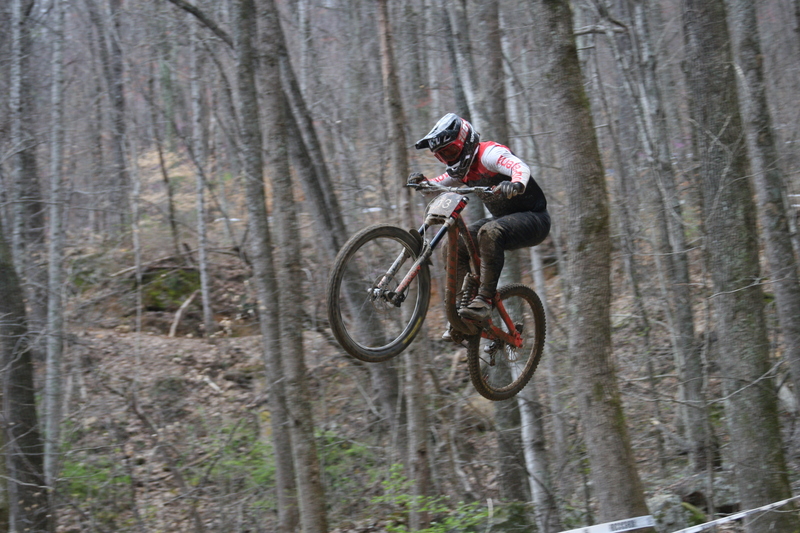 Tennessee National Mountain Bike Festival 2023 V.jpg :: Tennessee National 2023 - Tennessee Mountain Bike Festival 2023 - Windrock Bicycle Park in Oliver Springs, Tennessee, USA. Mountain Bike Downhill on the wooded trail in hills of Tennessee. Fast downhill action with aerials throughout the run. Red Bull gives you wings. 