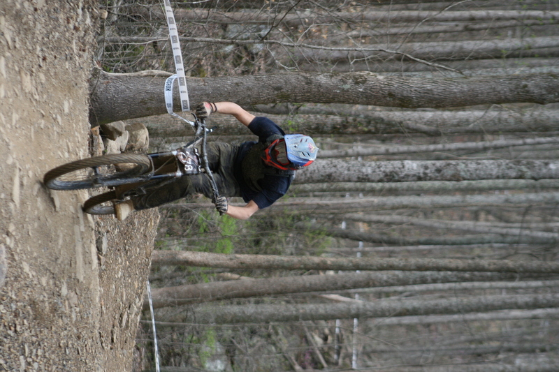 Tennessee National Mountain Bike Festival 2023 XI.jpg :: Tennessee National 2023 - Tennessee Mountain Bike Festival 2023 - Windrock Bicycle Park in Oliver Springs, Tennessee, USA. Mountain Bike Downhill on the wooded trail in hills of Tennessee. Fast downhill action with aerials throughout the run. Red Bull gives you wings. 