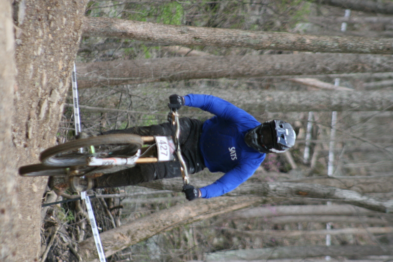 Tennessee National Mountain Bike Festival 2023 XVII.jpg :: Tennessee National 2023 - Tennessee Mountain Bike Festival 2023 - Windrock Bicycle Park in Oliver Springs, Tennessee, USA. Mountain Bike Downhill on the wooded trail in hills of Tennessee. Fast downhill action with aerials throughout the run. Red Bull gives you wings. 