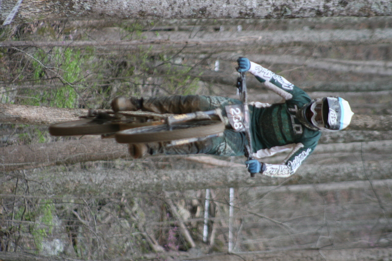 Tennessee National Mountain Bike Festival 2023 XVIII.jpg :: Tennessee National 2023 - Tennessee Mountain Bike Festival 2023 - Windrock Bicycle Park in Oliver Springs, Tennessee, USA. Mountain Bike Downhill on the wooded trail in hills of Tennessee. Fast downhill action with aerials throughout the run. Red Bull gives you wings. 