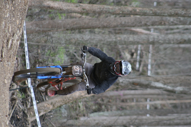 Tennessee National Mountain Bike Festival 2023 XXIII.jpg :: Tennessee National 2023 - Tennessee Mountain Bike Festival 2023 - Windrock Bicycle Park in Oliver Springs, Tennessee, USA. Mountain Bike Downhill on the wooded trail in hills of Tennessee. Fast downhill action with aerials throughout the run. Red Bull gives you wings. 