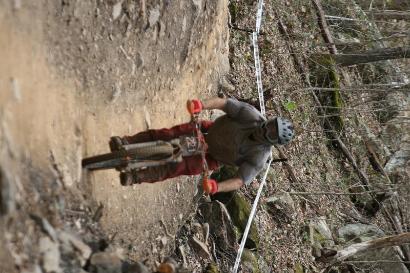 Tennessee National Mountain Bike Festival 2023 XXV.jpg :: Tennessee National 2023 - Tennessee Mountain Bike Festival 2023 - Windrock Bicycle Park in Oliver Springs, Tennessee, USA. Mountain Bike Downhill on the wooded trail in hills of Tennessee. Fast downhill action with aerials throughout the run. Red Bull gives you wings. 