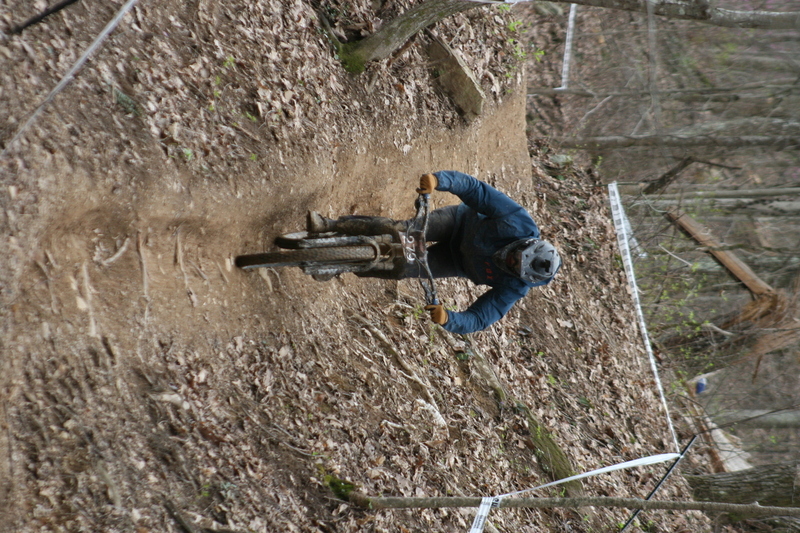 Tennessee National Mountain Bike Festival 2023 XXXI.jpg :: Tennessee National 2023 - Tennessee Mountain Bike Festival 2023 - Windrock Bicycle Park in Oliver Springs, Tennessee, USA. Mountain Bike Downhill on the wooded trail in hills of Tennessee. Fast downhill action with aerials throughout the run. Red Bull gives you wings. 