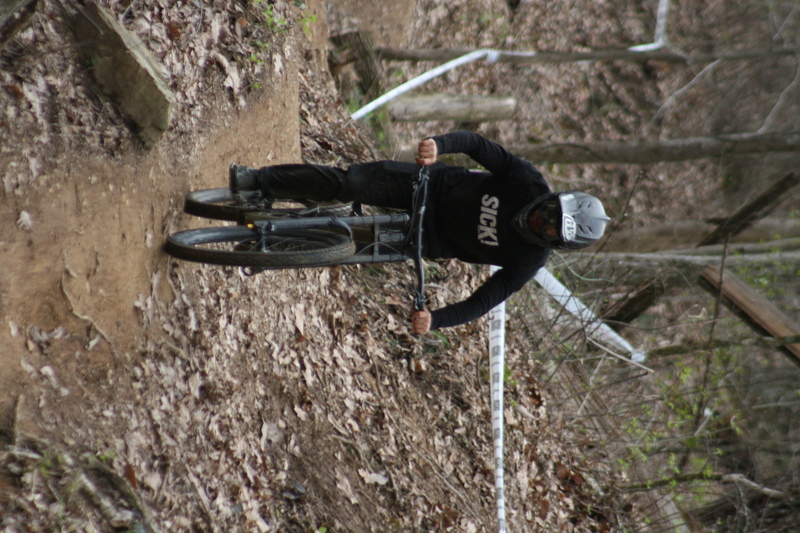 Tennessee National Mountain Bike Festival 2023 XXXII.jpg :: Tennessee National 2023 - Tennessee Mountain Bike Festival 2023 - Windrock Bicycle Park in Oliver Springs, Tennessee, USA. Mountain Bike Downhill on the wooded trail in hills of Tennessee. Fast downhill action with aerials throughout the run. Red Bull gives you wings. 