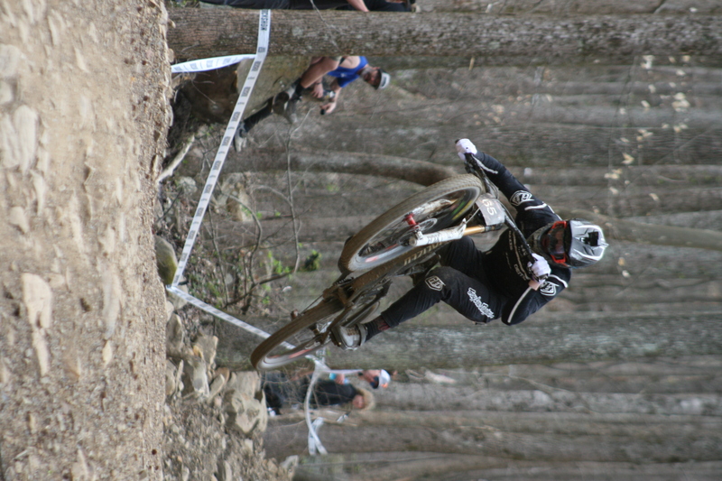Tennessee National Mountain Bike Festival 2023 XXXX.jpg :: Tennessee National 2023 - Tennessee Mountain Bike Festival 2023 - Windrock Bicycle Park in Oliver Springs, Tennessee, USA. Mountain Bike Downhill on the wooded trail in hills of Tennessee. Fast downhill action with aerials throughout the run. Red Bull gives you wings. 