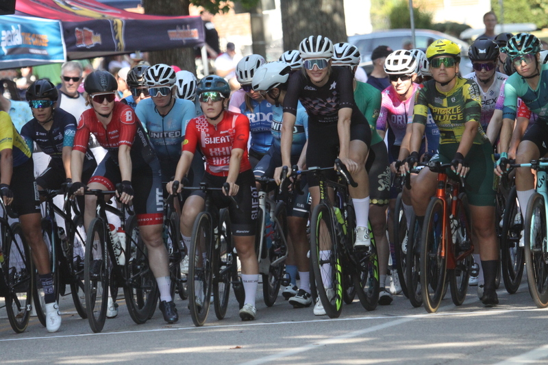 Tour De Francis Park 2025 C -LXXXXIV.jpg :: Tour de Francis Park 2025/Gateway Cup 2025 - Women's Pro CAT 1/2 70 Minutes of racing - Tour de Francis Park! Francis Park, named after David Rowland Francis - President of the Louisiana Purchase Exposition (the 1904 World's Fair) is known for its wide tree lined streets and for having beautiful churches on every corner. Today the St. Louis Hills neighborhood Showcases gingerbread bungalows, stately homes and some of the tidiest landscaping in St. Louis. - Gateway Cup Website - Riders that have been significantly delayed (have to get off bikes, step overriders, forced detour off course to continue, etc.) may report for a free lap. Rider's reporting are subject to the decision of the officials monitoring the course to allow the free lap. (web) Riders no longer have a free lap with four laps to the finish. Riders not on pace will be removed with four laps to the finish. This will remove slower riders not on lead lap and clear the course for riders sprinting for position. 