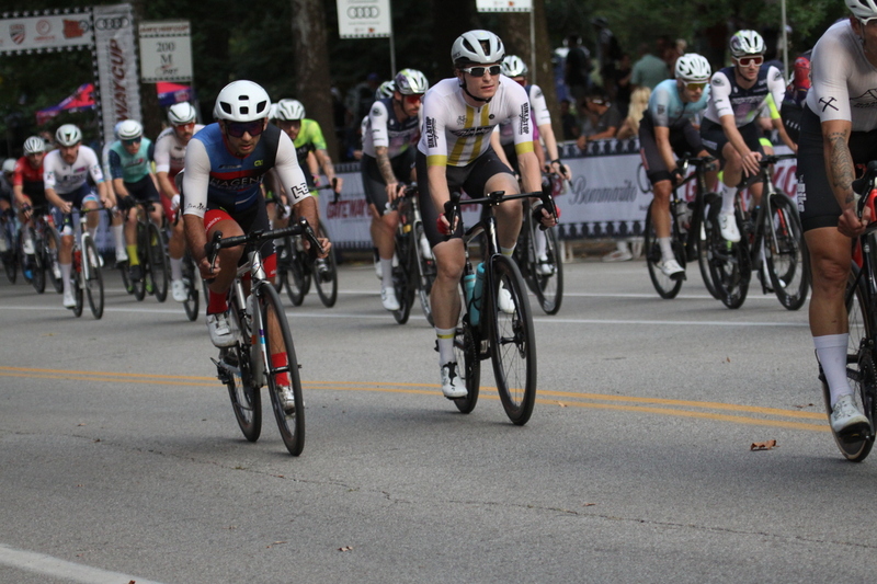 Tour De Francis Park 2025 E -LII.jpg :: Tour de Francis Park 2025/Gateway Cup 2025 - Men's Pro CAT 1, 70 minutes race, 150 rider field - Tour de Francis Park! Francis Park, named after David Rowland Francis - President of the Louisiana Purchase Exposition (the 1904 World's Fair) is known for its wide, tree lined streets and for having beautiful churches on every corner. Today the St. Louis Hills neighborhood showcases gingerbread bungalows, stately homes and some of the tidiest landscaping in St. Louis. - (Gateway Cup website) - Peloton - in a bicycle race, the term - peloton - refers to the main group of riders, also known as the -pack- or -bunch-. Riders race in a pack to draft, which means they ride closely together to save energy and improve speed. (Google) This is a USA Cycling sanctioned race event. 