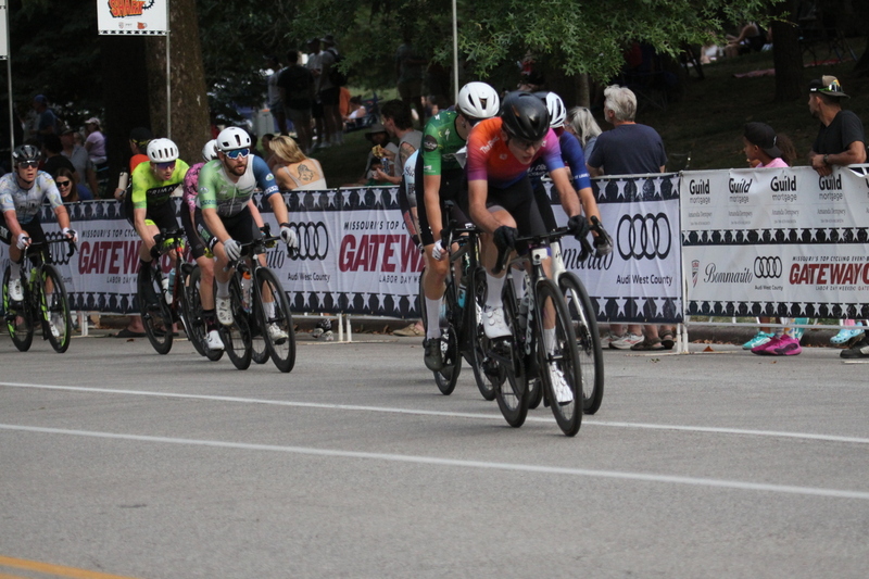 Tour De Francis Park 2025 E -LVI.jpg :: Tour de Francis Park 2025/Gateway Cup 2025 - Men's Pro CAT 1, 70 minutes race, 150 rider field - Tour de Francis Park! Francis Park, named after David Rowland Francis - President of the Louisiana Purchase Exposition (the 1904 World's Fair) is known for its wide, tree lined streets and for having beautiful churches on every corner. Today the St. Louis Hills neighborhood showcases gingerbread bungalows, stately homes and some of the tidiest landscaping in St. Louis. - (Gateway Cup website) - Peloton - in a bicycle race, the term - peloton - refers to the main group of riders, also known as the -pack- or -bunch-. Riders race in a pack to draft, which means they ride closely together to save energy and improve speed. (Google) This is a USA Cycling sanctioned race event. 