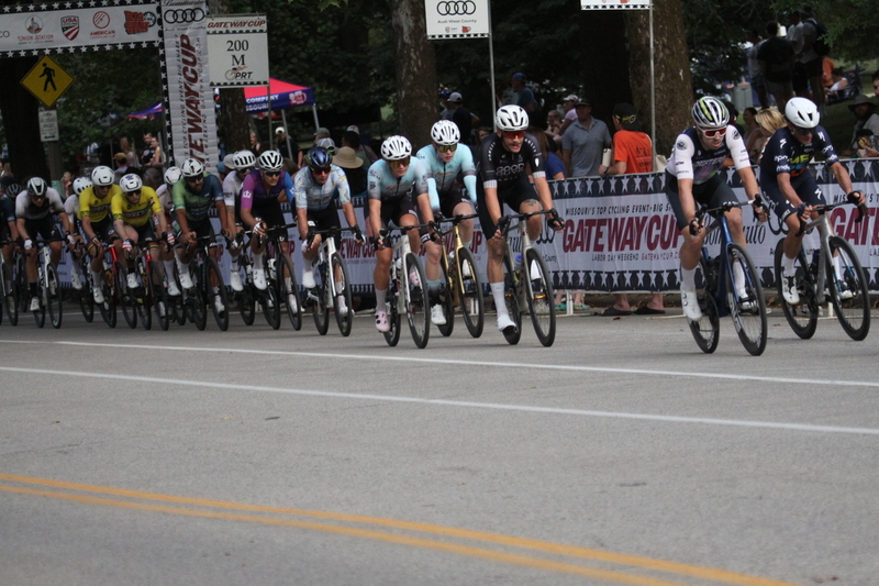 Tour De Francis Park 2025 E -LVIII.jpg :: Tour de Francis Park 2025/Gateway Cup 2025 - Men's Pro CAT 1, 70 minutes race, 150 rider field - Tour de Francis Park! Francis Park, named after David Rowland Francis - President of the Louisiana Purchase Exposition (the 1904 World's Fair) is known for its wide, tree lined streets and for having beautiful churches on every corner. Today the St. Louis Hills neighborhood showcases gingerbread bungalows, stately homes and some of the tidiest landscaping in St. Louis. - (Gateway Cup website) - Peloton - in a bicycle race, the term - peloton - refers to the main group of riders, also known as the -pack- or -bunch-. Riders race in a pack to draft, which means they ride closely together to save energy and improve speed. (Google) This is a USA Cycling sanctioned race event. 