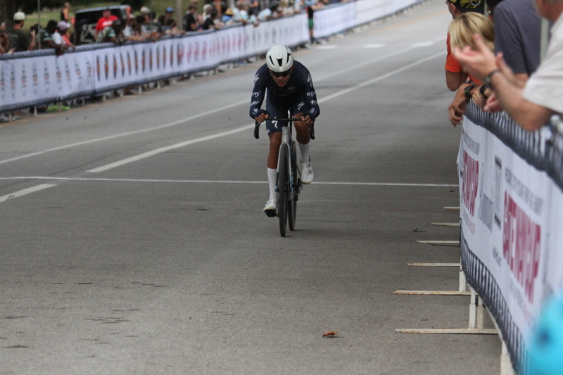 Tour De Francis Park 2025 E -LXVI.jpg :: Tour de Francis Park 2025/Gateway Cup 2025 - Men's Pro CAT 1, 70 minutes race, 150 rider field - Tour de Francis Park! Francis Park, named after David Rowland Francis - President of the Louisiana Purchase Exposition (the 1904 World's Fair) is known for its wide, tree lined streets and for having beautiful churches on every corner. Today the St. Louis Hills neighborhood showcases gingerbread bungalows, stately homes and some of the tidiest landscaping in St. Louis. - (Gateway Cup website) - Peloton - in a bicycle race, the term - peloton - refers to the main group of riders, also known as the -pack- or -bunch-. Riders race in a pack to draft, which means they ride closely together to save energy and improve speed. (Google) This is a USA Cycling sanctioned race event. 