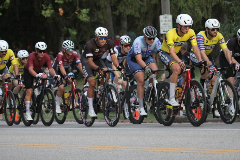 Tour De Francis Park 2025 E -XXXIII.jpg :: Tour de Francis Park 2025/Gateway Cup 2025 - Men's Pro CAT 1, 70 minutes race, 150 rider field - Tour de Francis Park! Francis Park, named after David Rowland Francis - President of the Louisiana Purchase Exposition (the 1904 World's Fair) is known for its wide, tree lined streets and for having beautiful churches on every corner. Today the St. Louis Hills neighborhood showcases gingerbread bungalows, stately homes and some of the tidiest landscaping in St. Louis. - (Gateway Cup website) - Peloton - in a bicycle race, the term - peloton - refers to the main group of riders, also known as the -pack- or -bunch-. Riders race in a pack to draft, which means they ride closely together to save energy and improve speed. (Google) This is a USA Cycling sanctioned race event. 