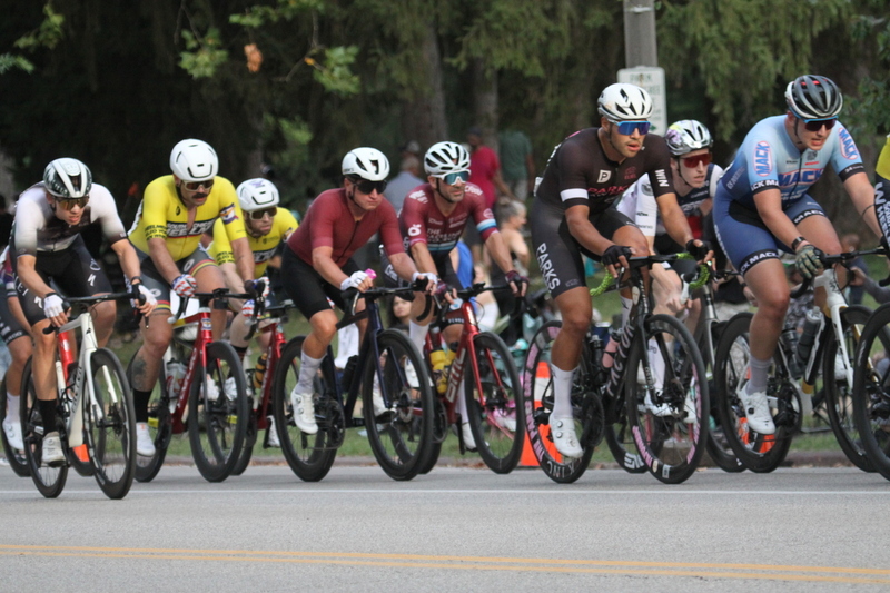 Tour De Francis Park 2025 E -XXXIV.jpg :: Tour de Francis Park 2025/Gateway Cup 2025 - Men's Pro CAT 1, 70 minutes race, 150 rider field - Tour de Francis Park! Francis Park, named after David Rowland Francis - President of the Louisiana Purchase Exposition (the 1904 World's Fair) is known for its wide, tree lined streets and for having beautiful churches on every corner. Today the St. Louis Hills neighborhood showcases gingerbread bungalows, stately homes and some of the tidiest landscaping in St. Louis. - (Gateway Cup website) - Peloton - in a bicycle race, the term - peloton - refers to the main group of riders, also known as the -pack- or -bunch-. Riders race in a pack to draft, which means they ride closely together to save energy and improve speed. (Google) This is a USA Cycling sanctioned race event. 