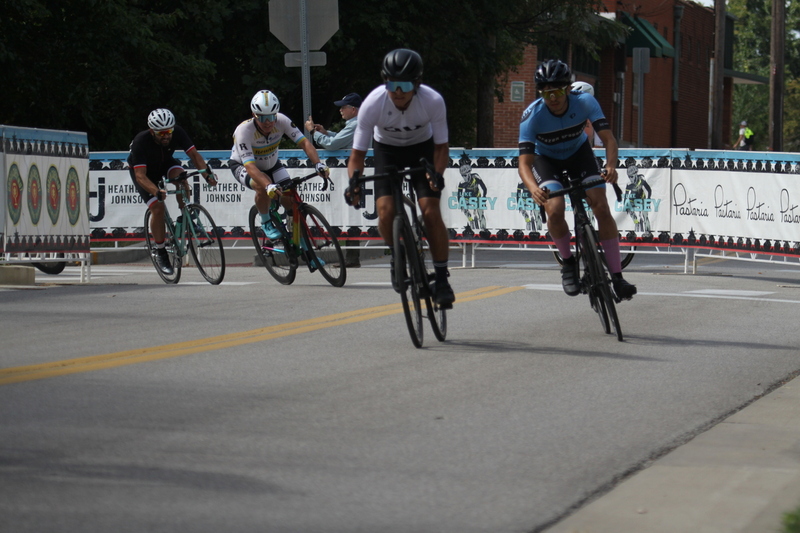 Tour de Florissant 2025 A -II.jpg :: Tour de Florissant 2025/Gateway Cup 2025, 2025 - September 1st- Men's Cat 4/5, 40 minutes of racing, a field of 75 riders - Tour de Florissant - New course for 2025! The fourth and final leg of the Gateway Cup gets underway in Historic Old Town Florissant in St. Louis County. This technical course races through one of St. Louis' most nostalgic locales. Note - the course has been shifted to a flat finish in front of Historic City Hall, one mild climb, 6 turns. Category 4 (CAT 4) After gaining some experience, riders can upgrade to CAT 4, where races are longer and more competitive. USA Cycling, Big Shark Bicycle Company, Bommarito Audi West County