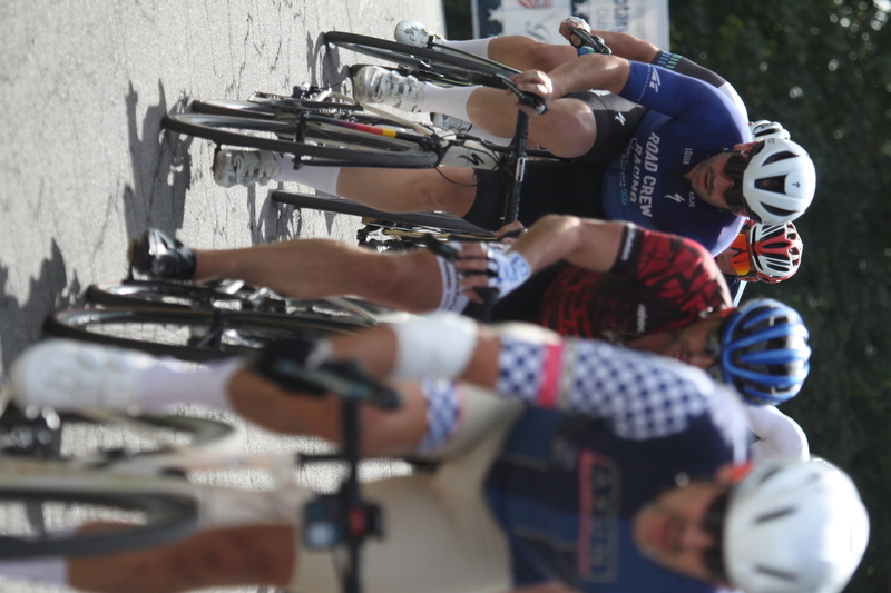 Tour de Florissant 2025 A -IV.jpg :: Tour de Florissant 2025/Gateway Cup 2025, 2025 - September 1st- Men's Cat 4/5, 40 minutes of racing, a field of 75 riders - Tour de Florissant - New course for 2025! The fourth and final leg of the Gateway Cup gets underway in Historic Old Town Florissant in St. Louis County. This technical course races through one of St. Louis' most nostalgic locales. Note - the course has been shifted to a flat finish in front of Historic City Hall, one mild climb, 6 turns. Category 4 (CAT 4) After gaining some experience, riders can upgrade to CAT 4, where races are longer and more competitive. USA Cycling, Big Shark Bicycle Company, Bommarito Audi West County