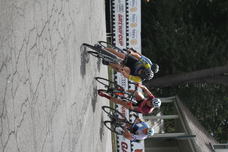 Tour de Florissant 2025 A -LIV.jpg :: Tour de Florissant 2025/Gateway Cup 2025 - Women's 3-4-5 & Women's 40+, 40 minutes of racing, a field of 75 riders - September, 1st, 2025 - Tour de Florissant - New Course for 2025! The fourth and final leg of the Gateway Cup gets underway in Historic Old Town Florissant in St. Louis County. This technical course races through one of St. Louis' most nostalgic locales. Note - the course has been shifted to a flat finish in front of Historic City Hall, one mild climb, 6 turns. Category 4 (CAT 4) After gaining some experience, riders can upgrade to CAT 4, where races are longer and more competitive. Category 3 (CAT 3) This intermediate category features longer and more challenging races, requiring a good understanding of racing tactics. USA Cycling 