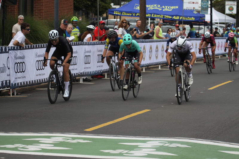 Tour de Florissant 2025 A -LXXXXIV.jpg :: Tour de Florissant 2025/Gateway Cup 2025 - Women's 3-4-5 & Women's 40+, 40 minutes of racing, a field of 75 riders - September, 1st, 2025 - Tour de Florissant - New Course for 2025! The fourth and final leg of the Gateway Cup gets underway in Historic Old Town Florissant in St. Louis County. This technical course races through one of St. Louis' most nostalgic locales. Note - the course has been shifted to a flat finish in front of Historic City Hall, one mild climb, 6 turns. Category 4 (CAT 4) After gaining some experience, riders can upgrade to CAT 4, where races are longer and more competitive. Category 3 (CAT 3) This intermediate category features longer and more challenging races, requiring a good understanding of racing tactics. USA Cycling 