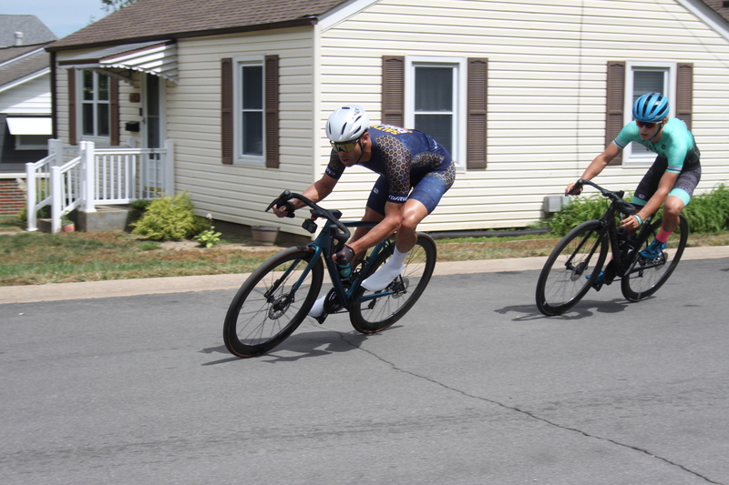 Tour de Florissant 2025 C -LXIX.jpg :: Tour de Florissant 2025/Gateway Cup 2025 - Men's CAT 3/4, 50 minutes of racing, a field of 100 - September 1st 2025 - Tour de Florissant - New Course for 2025! The fourth and final leg of the Gateway Cup gets underway in Historic Old Town Florissant in St. Louis County. This technical course races through one of St. Louis' most nostalgic locales. Note - the course has been shifted to a flat finish in front of Historic City Hall, one mild climb, 6 turns. Category 4 (CAT 4) After gaining some experience, riders can upgrade to CAT 4, where races are longer and more competitive. Category 3 (CAT 3) This intermediate category features longer and more challenging races, requiring a good understanding of racing tactics. USA Cycling