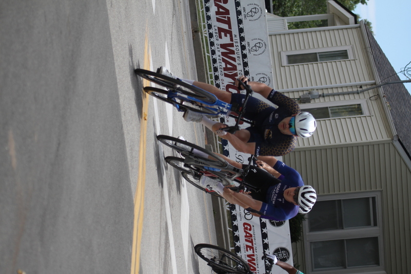 Tour de Florissant 2025 C -XXXXV.jpg :: Tour de Florissant 2025/Gateway Cup 2025 - Men's CAT 3/4, 50 minutes of racing, a field of 100 - September 1st 2025 - Tour de Florissant - New Course for 2025! The fourth and final leg of the Gateway Cup gets underway in Historic Old Town Florissant in St. Louis County. This technical course races through one of St. Louis' most nostalgic locales. Note - the course has been shifted to a flat finish in front of Historic City Hall, one mild climb, 6 turns. Category 4 (CAT 4) After gaining some experience, riders can upgrade to CAT 4, where races are longer and more competitive. Category 3 (CAT 3) This intermediate category features longer and more challenging races, requiring a good understanding of racing tactics. USA Cycling