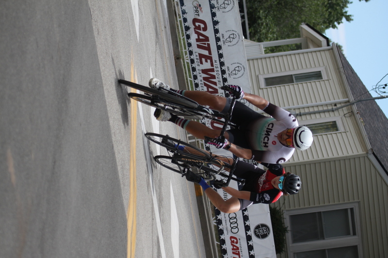 Tour de Florissant 2025 C -XXXXVIII.jpg :: Tour de Florissant 2025/Gateway Cup 2025 - Men's CAT 3/4, 50 minutes of racing, a field of 100 - September 1st 2025 - Tour de Florissant - New Course for 2025! The fourth and final leg of the Gateway Cup gets underway in Historic Old Town Florissant in St. Louis County. This technical course races through one of St. Louis' most nostalgic locales. Note - the course has been shifted to a flat finish in front of Historic City Hall, one mild climb, 6 turns. Category 4 (CAT 4) After gaining some experience, riders can upgrade to CAT 4, where races are longer and more competitive. Category 3 (CAT 3) This intermediate category features longer and more challenging races, requiring a good understanding of racing tactics. USA Cycling