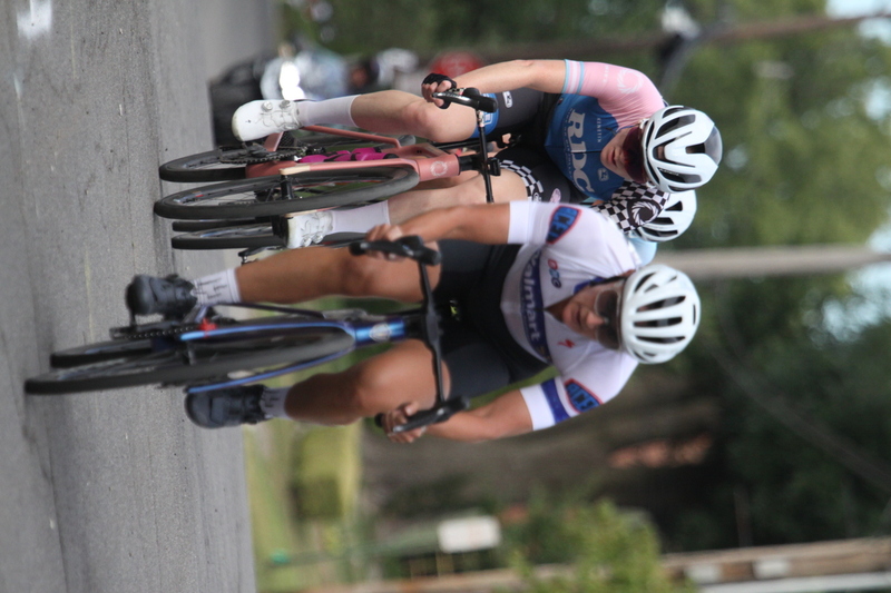 Tour de Florissant 2025 F -LXXXIX.jpg :: Tour de Florissant 2025 - Gateway Cup 2025 - September 1st 2025, Women's Pro CAT 1/2, 70 minutes of racing, a field of 150 racers, Tour de Florissant - New course for 2025! The fourth and final leg of the Gateway Cup gets underway in Historic Old Town Florissant in St. Louis County. This technical course races through one of St. Louis' most nostalgic locales. Note - the course has been shifted to a flat finish in front of Historic City Hall, one mild climb, 6 turns. Gateway Cup website - The finish of multiple races in USA Cycling is determined by the number of competitors in the field and the finishing position of the rider. For example, in a race with 5-10 competitors, the top finisher earns points, and the same applies to races with 11-20 competitors, 21-49 competitors, and so on. This points structure applies mass start races and is consistent across all disciplines of road racing. Additionally, there are ways to earn non-race upgrade points for Novice racers, such as finishing a USAC sanctioned Gran Fondo, which can count towards their required 10 upgrade points. 