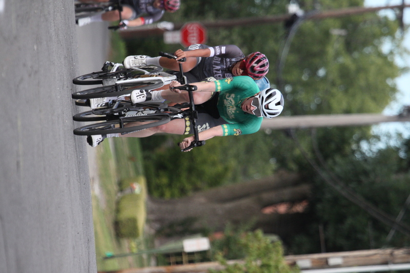 Tour de Florissant 2025 F -LXXXXI.jpg :: Tour de Florissant 2025 - Gateway Cup 2025 - September 1st 2025, Women's Pro CAT 1/2, 70 minutes of racing, a field of 150 racers, Tour de Florissant - New course for 2025! The fourth and final leg of the Gateway Cup gets underway in Historic Old Town Florissant in St. Louis County. This technical course races through one of St. Louis' most nostalgic locales. Note - the course has been shifted to a flat finish in front of Historic City Hall, one mild climb, 6 turns. Gateway Cup website - The finish of multiple races in USA Cycling is determined by the number of competitors in the field and the finishing position of the rider. For example, in a race with 5-10 competitors, the top finisher earns points, and the same applies to races with 11-20 competitors, 21-49 competitors, and so on. This points structure applies mass start races and is consistent across all disciplines of road racing. Additionally, there are ways to earn non-race upgrade points for Novice racers, such as finishing a USAC sanctioned Gran Fondo, which can count towards their required 10 upgrade points. 