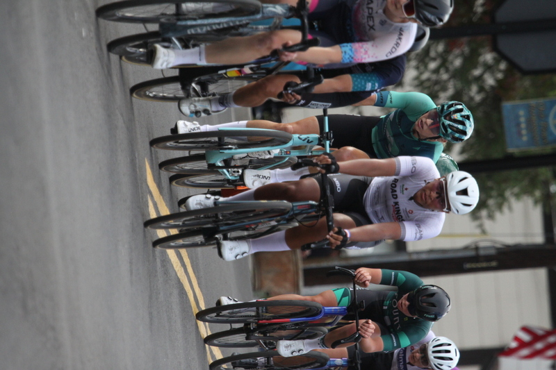 Tour de Florissant 2025 F -LXXXXIV.jpg :: Tour de Florissant 2025 - Gateway Cup 2025 - September 1st 2025, Women's Pro CAT 1/2, 70 minutes of racing, a field of 150 racers, Tour de Florissant - New course for 2025! The fourth and final leg of the Gateway Cup gets underway in Historic Old Town Florissant in St. Louis County. This technical course races through one of St. Louis' most nostalgic locales. Note - the course has been shifted to a flat finish in front of Historic City Hall, one mild climb, 6 turns. Gateway Cup website - The finish of multiple races in USA Cycling is determined by the number of competitors in the field and the finishing position of the rider. For example, in a race with 5-10 competitors, the top finisher earns points, and the same applies to races with 11-20 competitors, 21-49 competitors, and so on. This points structure applies mass start races and is consistent across all disciplines of road racing. Additionally, there are ways to earn non-race upgrade points for Novice racers, such as finishing a USAC sanctioned Gran Fondo, which can count towards their required 10 upgrade points. 