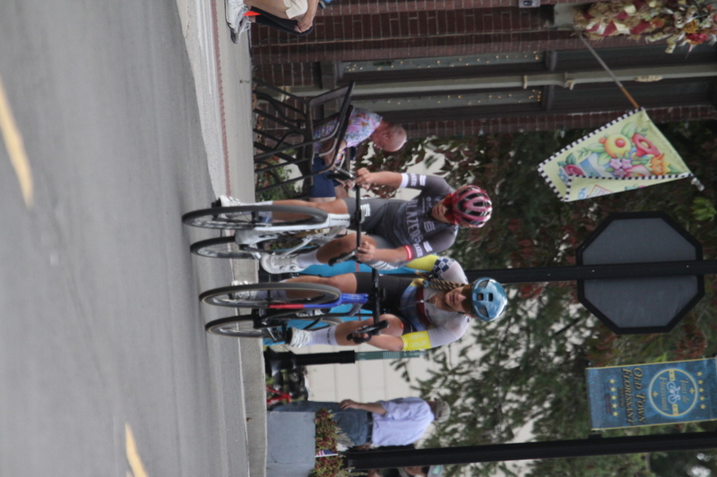 Tour de Florissant 2025 F -LXXXXIX.jpg :: Tour de Florissant 2025 - Gateway Cup 2025 - September 1st 2025, Women's Pro CAT 1/2, 70 minutes of racing, a field of 150 racers, Tour de Florissant - New course for 2025! The fourth and final leg of the Gateway Cup gets underway in Historic Old Town Florissant in St. Louis County. This technical course races through one of St. Louis' most nostalgic locales. Note - the course has been shifted to a flat finish in front of Historic City Hall, one mild climb, 6 turns. Gateway Cup website - The finish of multiple races in USA Cycling is determined by the number of competitors in the field and the finishing position of the rider. For example, in a race with 5-10 competitors, the top finisher earns points, and the same applies to races with 11-20 competitors, 21-49 competitors, and so on. This points structure applies mass start races and is consistent across all disciplines of road racing. Additionally, there are ways to earn non-race upgrade points for Novice racers, such as finishing a USAC sanctioned Gran Fondo, which can count towards their required 10 upgrade points. 