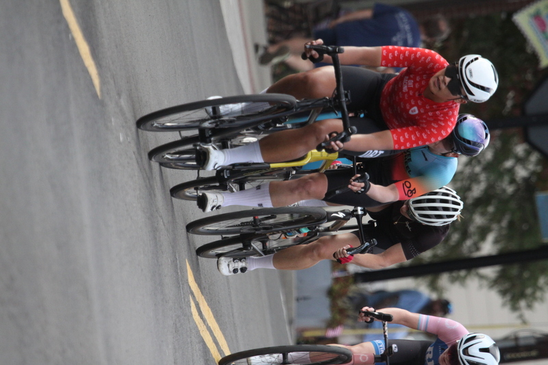 Tour de Florissant 2025 F -LXXXXVII.jpg :: Tour de Florissant 2025 - Gateway Cup 2025 - September 1st 2025, Women's Pro CAT 1/2, 70 minutes of racing, a field of 150 racers, Tour de Florissant - New course for 2025! The fourth and final leg of the Gateway Cup gets underway in Historic Old Town Florissant in St. Louis County. This technical course races through one of St. Louis' most nostalgic locales. Note - the course has been shifted to a flat finish in front of Historic City Hall, one mild climb, 6 turns. Gateway Cup website - The finish of multiple races in USA Cycling is determined by the number of competitors in the field and the finishing position of the rider. For example, in a race with 5-10 competitors, the top finisher earns points, and the same applies to races with 11-20 competitors, 21-49 competitors, and so on. This points structure applies mass start races and is consistent across all disciplines of road racing. Additionally, there are ways to earn non-race upgrade points for Novice racers, such as finishing a USAC sanctioned Gran Fondo, which can count towards their required 10 upgrade points. 