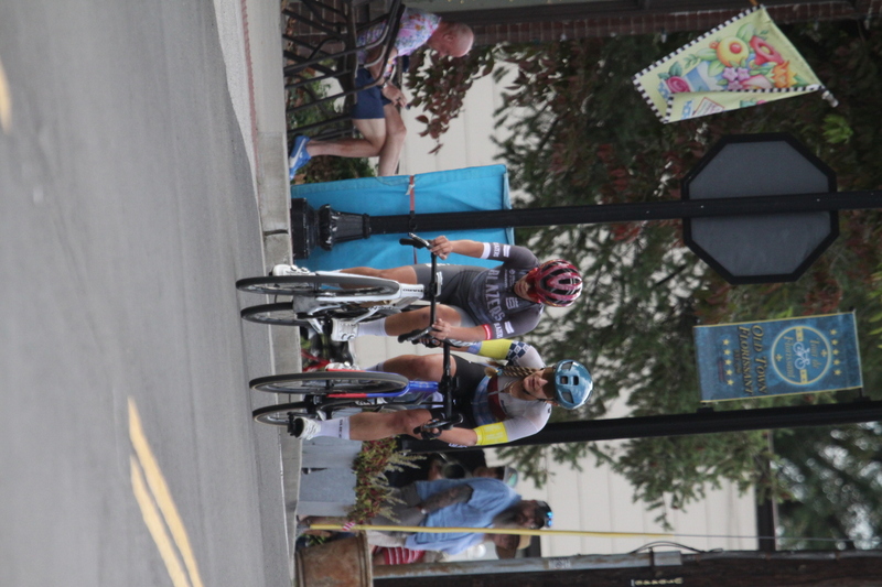 Tour de Florissant 2025 F -LXXXXVIII.jpg :: Tour de Florissant 2025 - Gateway Cup 2025 - September 1st 2025, Women's Pro CAT 1/2, 70 minutes of racing, a field of 150 racers, Tour de Florissant - New course for 2025! The fourth and final leg of the Gateway Cup gets underway in Historic Old Town Florissant in St. Louis County. This technical course races through one of St. Louis' most nostalgic locales. Note - the course has been shifted to a flat finish in front of Historic City Hall, one mild climb, 6 turns. Gateway Cup website - The finish of multiple races in USA Cycling is determined by the number of competitors in the field and the finishing position of the rider. For example, in a race with 5-10 competitors, the top finisher earns points, and the same applies to races with 11-20 competitors, 21-49 competitors, and so on. This points structure applies mass start races and is consistent across all disciplines of road racing. Additionally, there are ways to earn non-race upgrade points for Novice racers, such as finishing a USAC sanctioned Gran Fondo, which can count towards their required 10 upgrade points. 