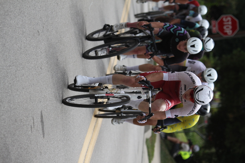 Tour de Florissant 2025 F -XXII.jpg :: Tour de Florissant 2025 - Gateway Cup 2025 - September 1st 2025 - Men's CAT 2-3, 55 Minutes of racing, a field of 150 racers - Tour de Florissant - New course for 2025! The fourth and final leg of the Gateway Cup gets underway in Historic Old Town Florissant in St. Louis County. This technical course races through one of St. Louis' most nostalgic locales. Note - the course has been shifted to a flat finish in front of Historic City Hall, one mild climb, 6 turns. Gateway Cup website - In mass start cycling racers, the winner is determined by the first rider to cross the finish line. However, the race format can vary, and some events may have additional criteria or rules that can influence the winner. For example, in points races, the rider with the most points at the end of the race wins, and in sprint events, the winner is determined by the third rider to cross the finish line after a series of sprints. Wikipedia - The slower riders will be asked to exit the racecourse if not on the lead lap with five laps to go. This is to not interrupt the lead lap riders that are going to have the hard fast finish. Riders in lower categories are given one lap to go with two or three laps to go. This determines the winner of the lower category race in mass start race finishes for this event. Pace motorcycles help keep track of slower riders and categories. Given a number and riders to watch. 