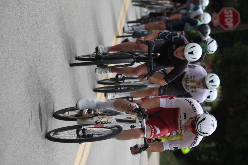 Tour de Florissant 2025 F -XXIII.jpg :: Tour de Florissant 2025 - Gateway Cup 2025 - September 1st 2025 - Men's CAT 2-3, 55 Minutes of racing, a field of 150 racers - Tour de Florissant - New course for 2025! The fourth and final leg of the Gateway Cup gets underway in Historic Old Town Florissant in St. Louis County. This technical course races through one of St. Louis' most nostalgic locales. Note - the course has been shifted to a flat finish in front of Historic City Hall, one mild climb, 6 turns. Gateway Cup website - In mass start cycling racers, the winner is determined by the first rider to cross the finish line. However, the race format can vary, and some events may have additional criteria or rules that can influence the winner. For example, in points races, the rider with the most points at the end of the race wins, and in sprint events, the winner is determined by the third rider to cross the finish line after a series of sprints. Wikipedia - The slower riders will be asked to exit the racecourse if not on the lead lap with five laps to go. This is to not interrupt the lead lap riders that are going to have the hard fast finish. Riders in lower categories are given one lap to go with two or three laps to go. This determines the winner of the lower category race in mass start race finishes for this event. Pace motorcycles help keep track of slower riders and categories. Given a number and riders to watch. 