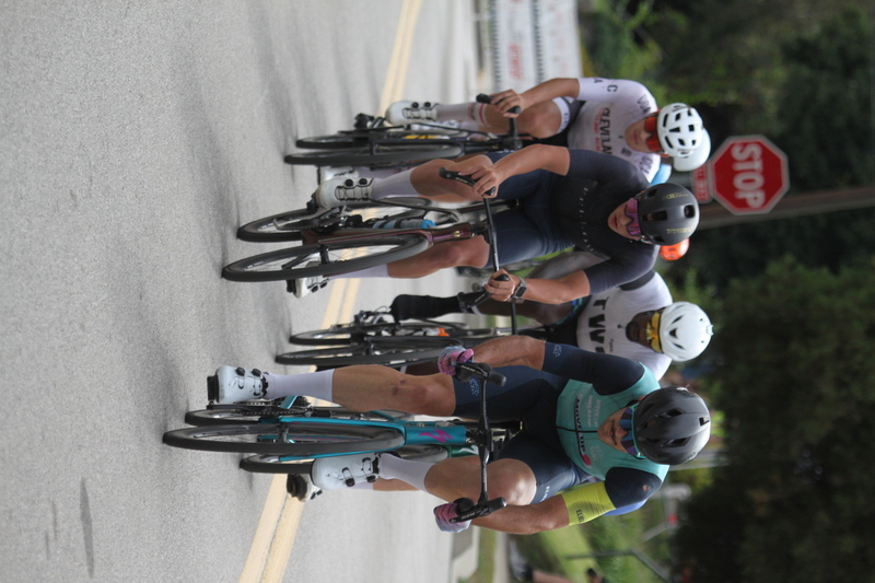 Tour de Florissant 2025 F -XXIV.jpg :: Tour de Florissant 2025 - Gateway Cup 2025 - September 1st 2025 - Men's CAT 2-3, 55 Minutes of racing, a field of 150 racers - Tour de Florissant - New course for 2025! The fourth and final leg of the Gateway Cup gets underway in Historic Old Town Florissant in St. Louis County. This technical course races through one of St. Louis' most nostalgic locales. Note - the course has been shifted to a flat finish in front of Historic City Hall, one mild climb, 6 turns. Gateway Cup website - In mass start cycling racers, the winner is determined by the first rider to cross the finish line. However, the race format can vary, and some events may have additional criteria or rules that can influence the winner. For example, in points races, the rider with the most points at the end of the race wins, and in sprint events, the winner is determined by the third rider to cross the finish line after a series of sprints. Wikipedia - The slower riders will be asked to exit the racecourse if not on the lead lap with five laps to go. This is to not interrupt the lead lap riders that are going to have the hard fast finish. Riders in lower categories are given one lap to go with two or three laps to go. This determines the winner of the lower category race in mass start race finishes for this event. Pace motorcycles help keep track of slower riders and categories. Given a number and riders to watch. 