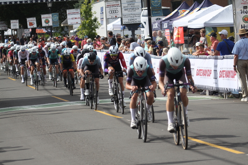Tour de Florissant 2025 F -XXIX.jpg :: Tour de Florissant 2025 - Gateway Cup 2025 - September 1st 2025 - Men's CAT 2-3, 55 Minutes of racing, a field of 150 racers - Tour de Florissant - New course for 2025! The fourth and final leg of the Gateway Cup gets underway in Historic Old Town Florissant in St. Louis County. This technical course races through one of St. Louis' most nostalgic locales. Note - the course has been shifted to a flat finish in front of Historic City Hall, one mild climb, 6 turns. Gateway Cup website - In mass start cycling racers, the winner is determined by the first rider to cross the finish line. However, the race format can vary, and some events may have additional criteria or rules that can influence the winner. For example, in points races, the rider with the most points at the end of the race wins, and in sprint events, the winner is determined by the third rider to cross the finish line after a series of sprints. Wikipedia - The slower riders will be asked to exit the racecourse if not on the lead lap with five laps to go. This is to not interrupt the lead lap riders that are going to have the hard fast finish. Riders in lower categories are given one lap to go with two or three laps to go. This determines the winner of the lower category race in mass start race finishes for this event. Pace motorcycles help keep track of slower riders and categories. Given a number and riders to watch. 